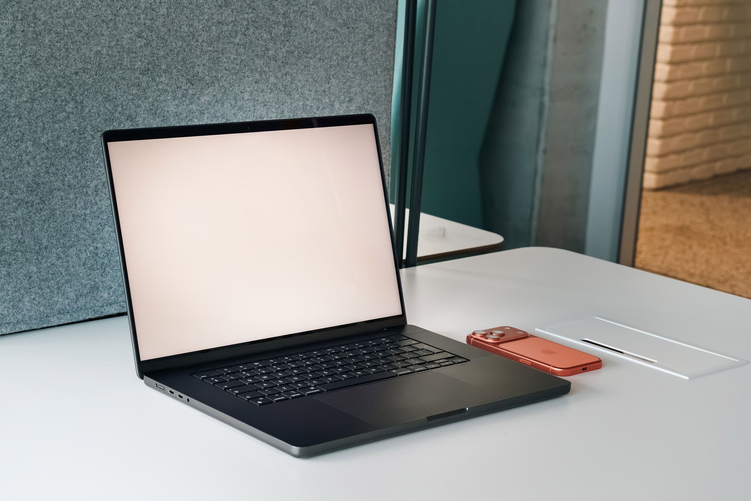 Laptop and phone on a bright modern workspace